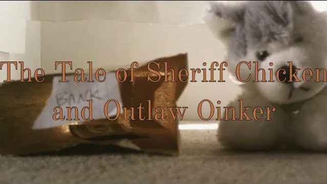 The Tale of Sheriff Chicken and Outlaw Oinker Thumbnail
